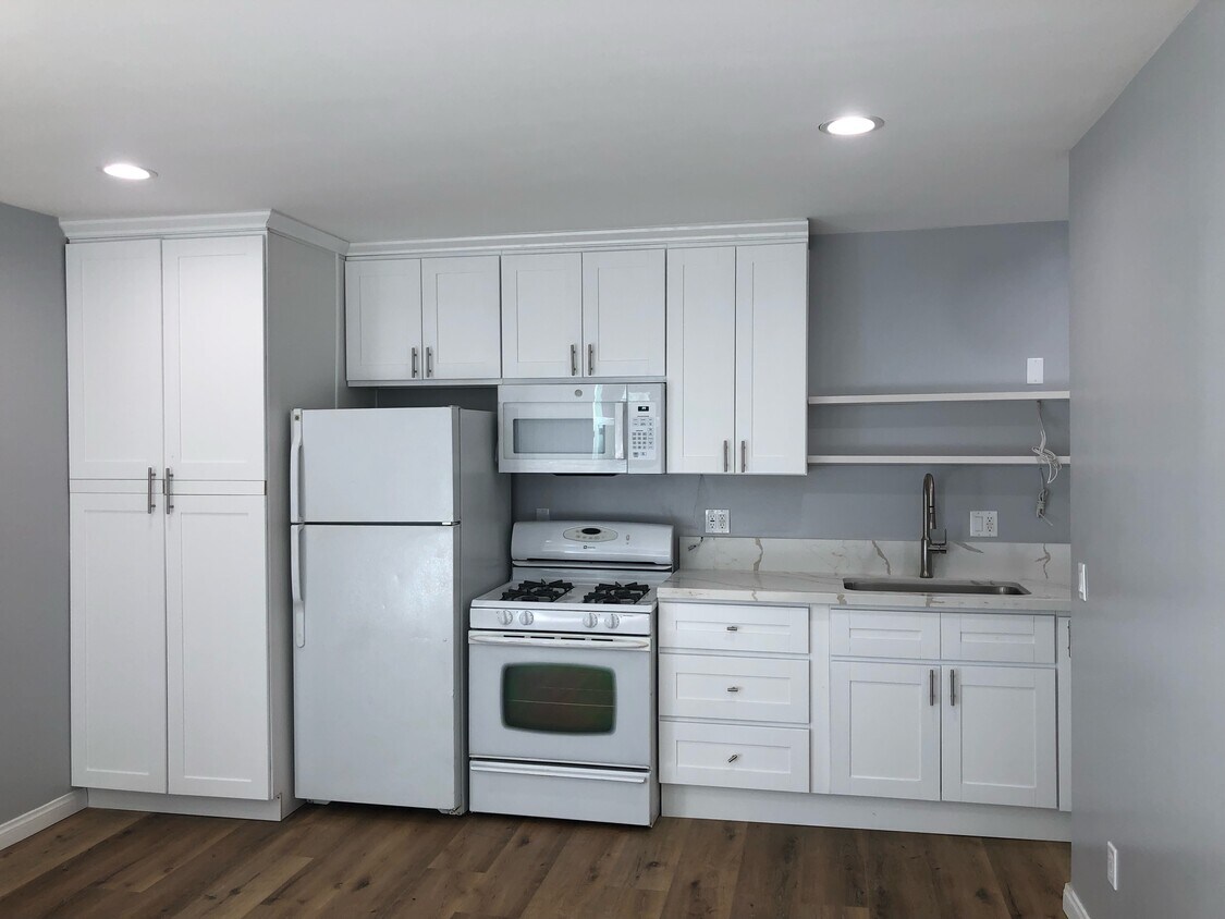 Left is laundry cabinet,including Washer/dryer - 5225 Etiwanda Ave