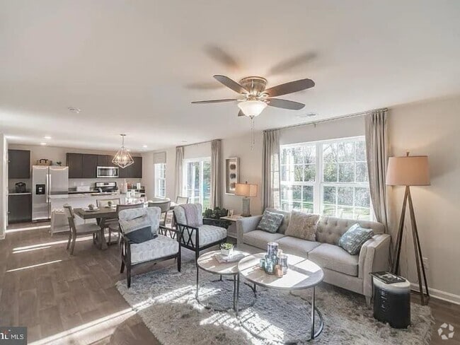 Naturally lit living space on main level - 377 Aylesbury Ln