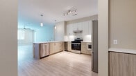 Located in Rancho Cucamonga, CA, this single-story 4-bedroom, 2-bathroom home offers a well-designed layout with a thoughtful blend of modern finishes and functional living spaces. The open-concept kitchen is a standout feature, showcasing two-tone cabinetry with crisp white upper cabinets and warm wood-toned lower cabinets, stainless steel appliances including a gas range, dishwasher, and French door refrigerator, plus a built-in wine cooler. A peninsula with a white countertop and pendant lighting ties the kitchen to the living area, where light hardwood-style flooring extends throughout. The living room receives abundant natural light through large windows and a glass door leading outside. The four bedrooms are carpeted and feature neutral warm-toned walls, window blinds, and ceiling fans for comfort. The generously sized primary bedroom is accompanied by a walk-in closet with built-in shelving and rods. The primary bathroom is finished with large-format tile flooring, a soaking tub, a separate shower, and a white vanity with ample storage. A hallway connects all rooms efficiently, and the home also includes a laundry area. This home's clean, contemporary aesthetic and practical floor plan make it a highly functional residence.