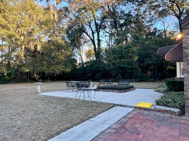 Furnished patio area in the private huge backyard - 902 Penn Waller Rd