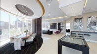 This single-floor amenity space showcases a sleek, contemporary design with an open-plan layout that seamlessly integrates multiple functional areas. The interior is defined by striking architectural details, including a dramatic circular ceiling feature with a bold gold accent ring and recessed lighting, which anchors the dining area below. A large communal dining table surrounded by white chairs sits atop a rich, dark circular area rug, creating an elegant contrast against the high-gloss white tile flooring that extends throughout the space.

A series of dark vertical wooden slat partitions provides subtle separation between zones without compromising the open, airy feel. At the center of the space, a stylish entertainment area features a wall-mounted flat-screen TV, flanked by bold magenta accent chairs and a sleek dark reception-style console. Further into the space, a comfortable lounge seating area offers a relaxed retreat.

A full-size billiards table commands its own dedicated area, adding a recreational focal point to the space. Floor-to-ceiling windows flood the interior with abundant natural light and frame expansive city skyline views, reinforcing the modern urban character of the space. Thoughtful lighting, high ceilings, and a carefully curated palette of dark wood, white, and gold accents combine to create an atmosphere that is both refined and inviting.