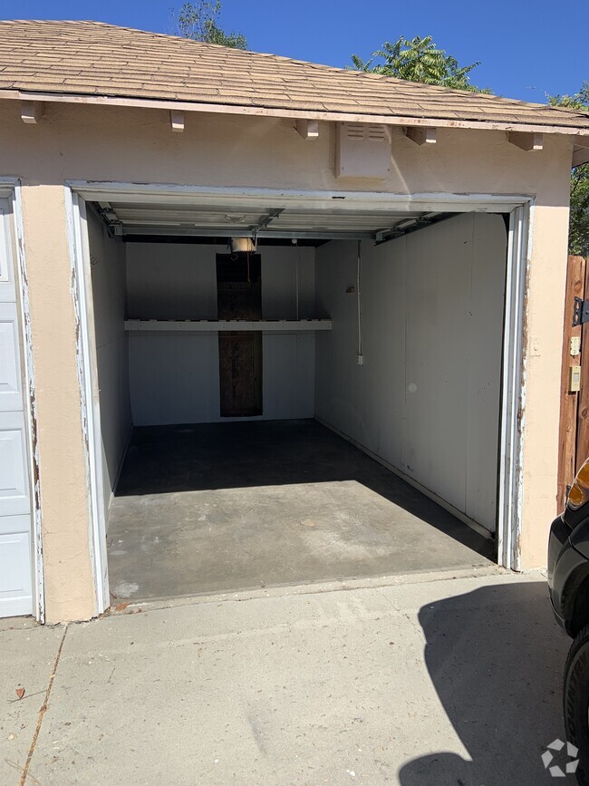 One covered Garage + driveway parking - 1025 Locust St