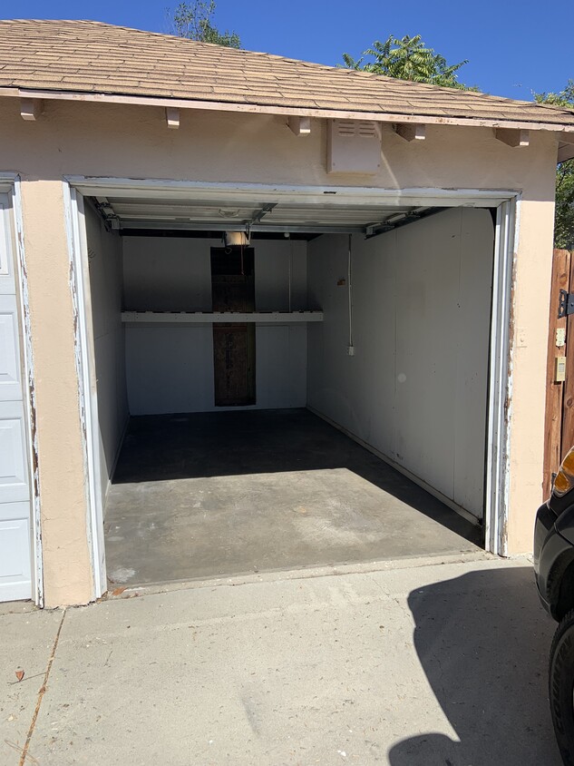 One covered Garage + driveway parking - 1025 Locust St