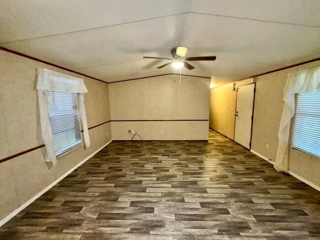 Building Photo - Three bedroom two bath Castleberry manufactured home with a screen porch and carport!