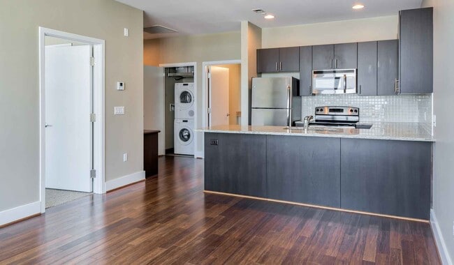 Spacious floor plans with wood flooring throughout - SouthStar Lofts