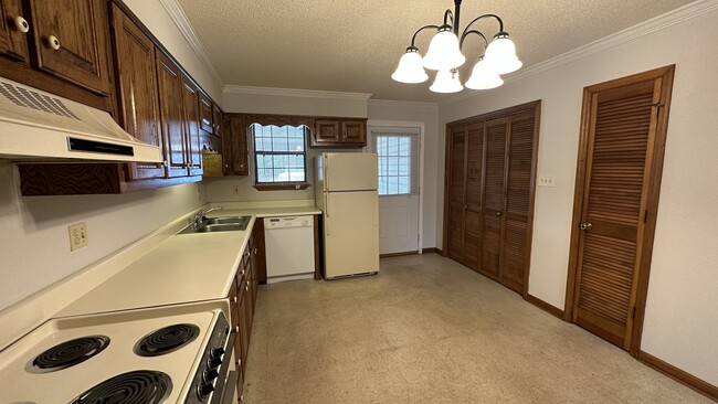 Kitchen has new disposal, stove and new light fixture - 1418 Brookline Ave SW