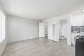 Located at 3505 W 139th St in Hawthorne, CA, this single-floor, one-bedroom, one-bathroom unit offers a thoughtfully utilized layout with a bright and clean modern aesthetic. Light wood-style flooring runs throughout the entire space, lending a cohesive and airy feel to every room.

The open main area seamlessly connects the living space to the kitchen, which features white shaker-style cabinetry, a mosaic tile backsplash in gray and white tones, a stainless steel gas range, and an overhead microwave — providing a fully functional cooking area. The kitchen flows naturally into the living space, making the layout feel efficient and connected.

The bedroom is generously proportioned relative to the overall footprint, bathed in natural light through a large window fitted with vertical blinds. The textured popcorn ceiling and neutral wall tones create a calm, understated atmosphere. A built-in shelved closet offers practical storage.

The bathroom is clean and well-appointed, featuring a full tub-shower combination with a handheld showerhead, white tile surround, a white vanity with sink, and wood-style tile flooring that mirrors the rest of the unit. The overall design is consistent and fresh throughout, making this a well-maintained and efficiently designed living space.