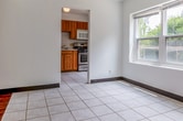 This 630 square foot single-story home in Madison, Wisconsin offers a practical and efficient living space. The property features two bedrooms, including a primary bedroom of 110 square feet, and one bathroom. The layout includes a kitchen, dining room, living room, and hallway, providing a well-organized flow throughout the home.

The kitchen is equipped with modern appliances, including a stainless steel range and microwave. Oak cabinetry provides ample storage, while a tiled floor offers durability and easy maintenance. The bathroom features a standard tub-shower combination with neutral-toned tiling and essential fixtures.

Bedrooms are carpeted for comfort and include built-in storage solutions. The living areas showcase a mix of carpeting and hardwood flooring, adding warmth and character to the space. Large windows in various rooms allow for plenty of natural light and offer views of the surrounding greenery.

Ceiling fans in multiple rooms provide air circulation and comfort. The home's neutral color palette and clean lines create a blank canvas for personalization. Despite its compact size, the property makes efficient use of space with built-in storage options throughout.

Located at 19 Sherman Terr, this home provides a cozy and functional living environment in a desirable Madison neighborhood.