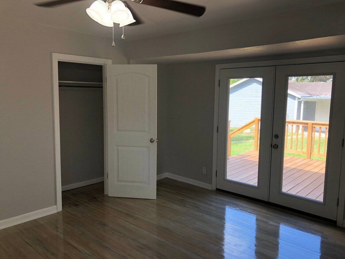 Your very large Master bedroom has a large French Door leads out to your 12x13 custom wood deck with steps down to your large backyard! - 914 Campbell St