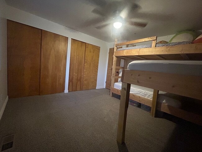 SE bdrm. Beautiful fall wallpaper. Double closet. Ceiling fan. - 3780 W Montana St