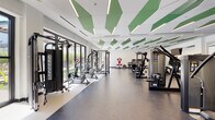This contemporary fitness center is thoughtfully designed to support a full range of workout routines in a bright, spacious environment. The space is immediately distinguished by its striking ceiling treatment — geometric green acoustic panels interspersed with linear LED lighting create a visually dynamic overhead plane while managing sound throughout the facility.

The floor plan is organized into distinct functional zones. A dedicated cardio area lines one side of the space, featuring a row of treadmills and stationary bikes, each equipped with individual screens for entertainment. Large wall-mounted mirrors amplify the sense of openness and allow users to monitor their form. Adjacent to the cardio zone, a comprehensive strength training area houses cable machines, power racks with benches, and a full dumbbell rack, providing options for both free weight and machine-based training. A standout feature is the interactive boxing/training unit, adding a modern, tech-forward element to the workout options.

Floor-to-ceiling glass doors and windows along one wall flood the interior with natural light and open onto views of an outdoor courtyard, creating a seamless indoor-outdoor connection. The rubber flooring throughout provides both durability and comfort underfoot. A functional training corner offers medicine balls, stability equipment, step platforms, and additional accessories. The overall ambiance is clean, modern, and energizing.