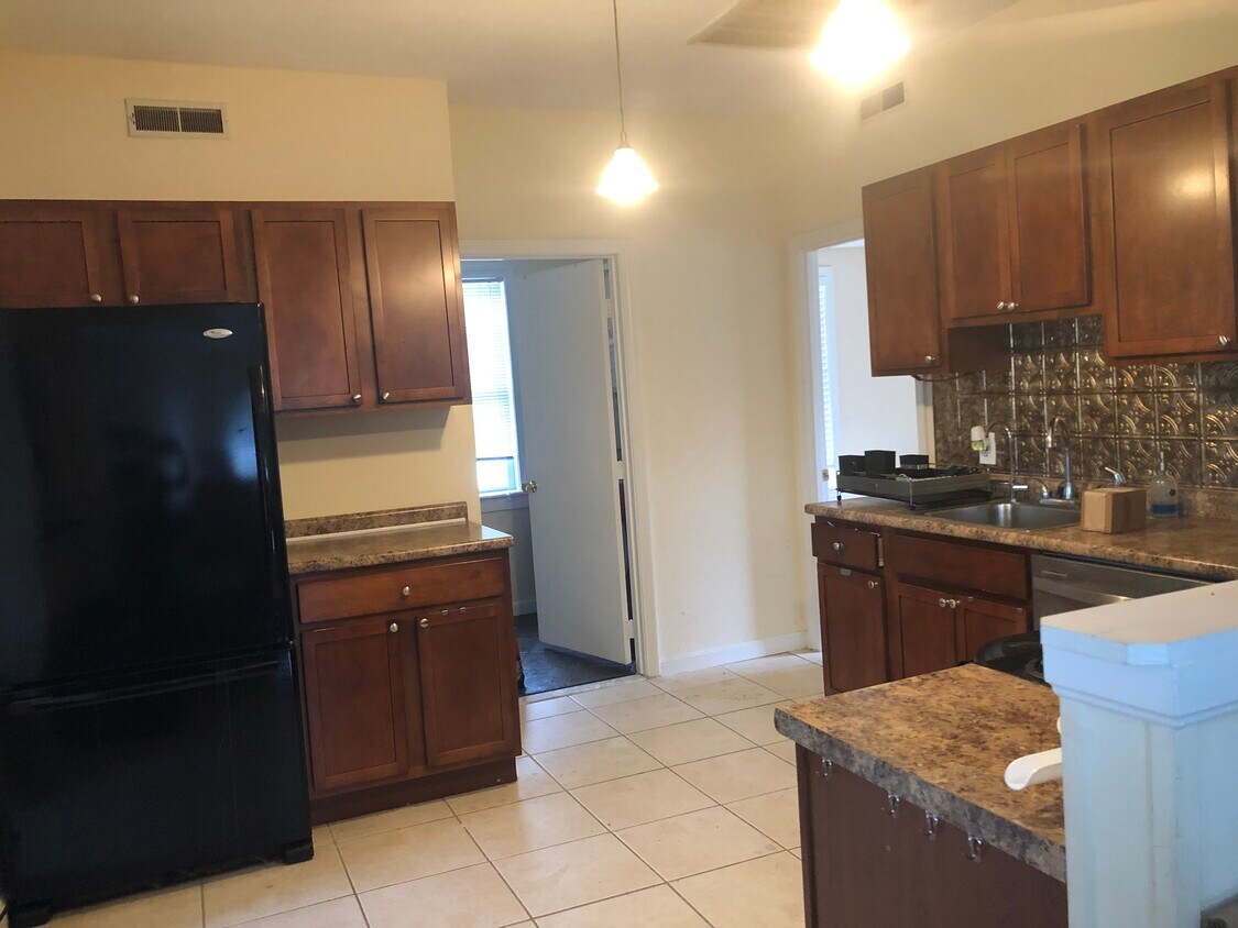 Kitchen looking into main floor bathroom and bedroom 1 - 829 Princeton Blvd