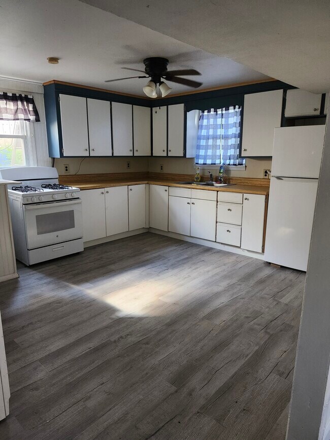 Large eat in kitchen, with new flooring & cabinet fronts. Has newer refrigerator & stove - 30 Glendale Ave