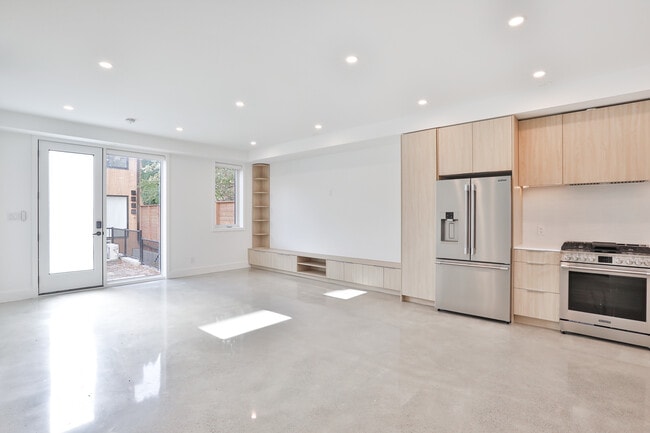 Open plan main floor with polished concrete flooring - 68 Foxley St