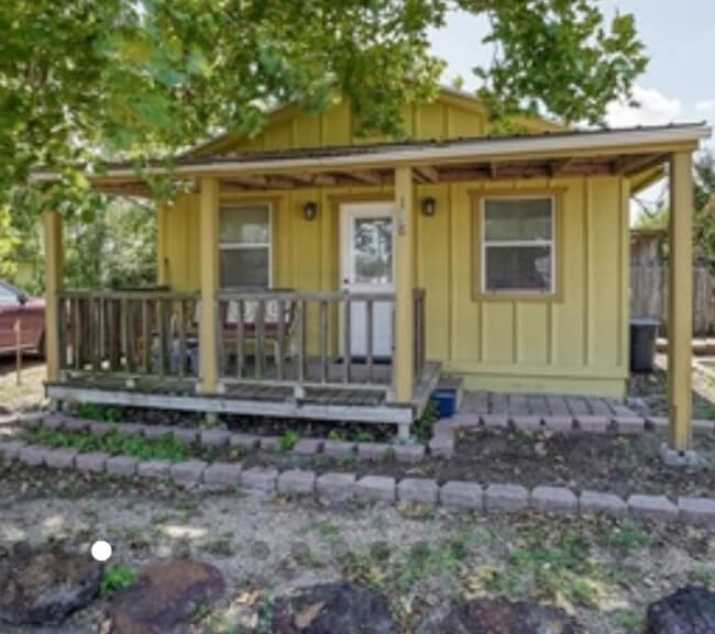House has been painted white with black trim! - 128 Gonzales St