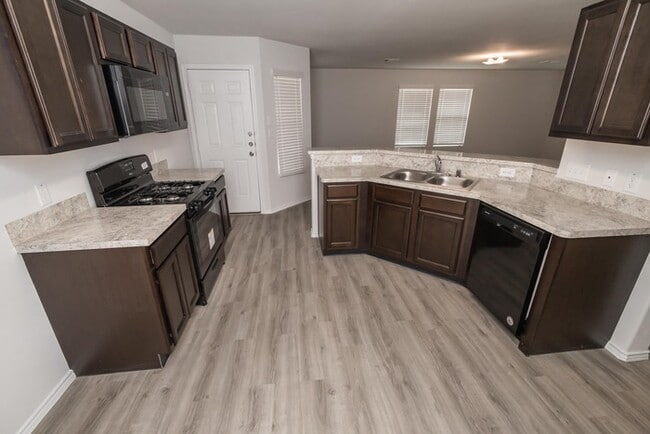 Building Photo - Lone Trail Village - 9214 Yellow Rose Driv...