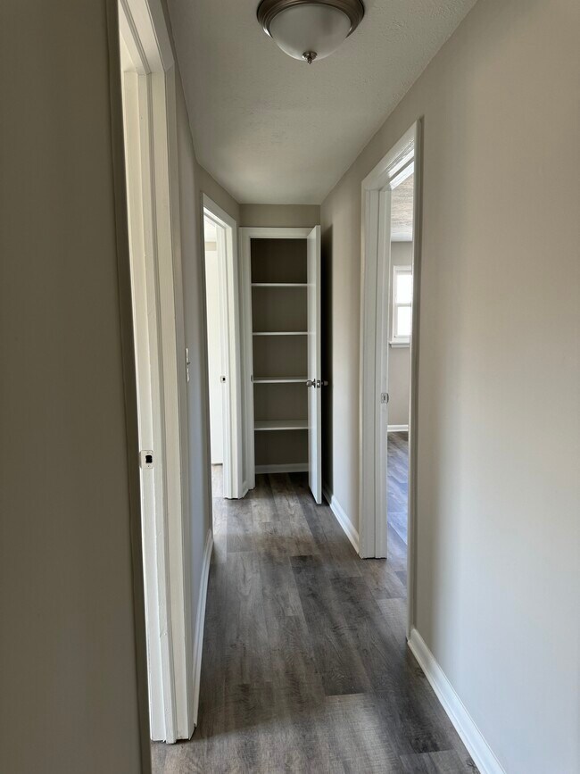 2nd floor hall looking towards linen closet & 3 bedrooms (bathroom is to the right but out of view) - 32953 Alva Dr