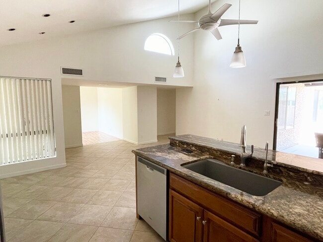 Kitchen looking to den and hallway - 9463 E Jenan Dr