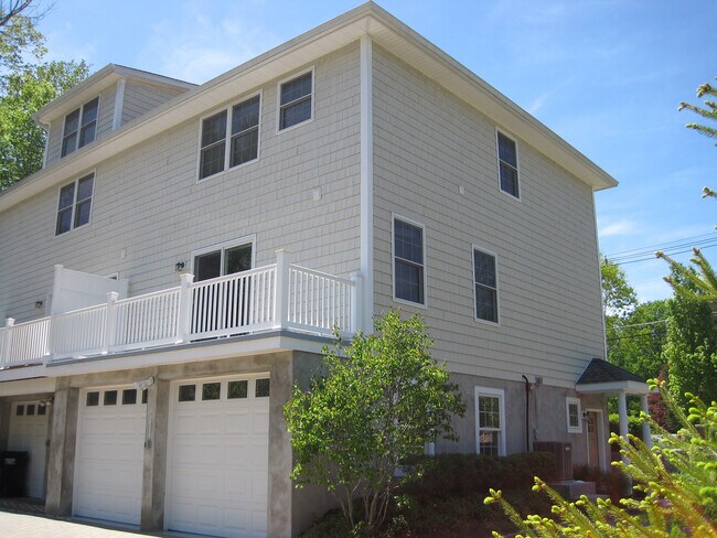 Exterior of unit with garage and balcony deck - 24 North St