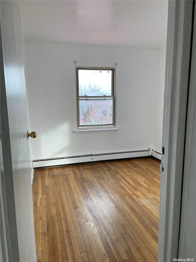 Building Photo - 30-57-57 69th St