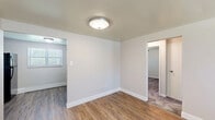 Located at 3 Marhoefer Drive in Pleasant Hills, PA, this two-bedroom, one-bathroom unit offers a practical and well-appointed single-floor layout. The living area welcomes you with warm hardwood-style flooring, neutral walls, and a large window that fills the space with natural light, creating a bright and inviting atmosphere.

The kitchen is thoughtfully designed with rich dark cabinetry, granite-look countertops, and black appliances including a gas range, refrigerator, and range hood. Hardwood-style flooring continues throughout, and a window above the counter area brings in additional natural light.

Both bedrooms feature plush carpeting, ceiling fans with light fixtures, and windows with blinds. The primary bedroom is a comfortable size and includes a closet, while the second bedroom also offers dedicated closet space. A carpeted hallway connects the bedrooms and bathroom, providing a cohesive flow through the private areas of the unit.

Throughout the space, clean white trim and neutral paint tones create a fresh, move-in ready aesthetic. Baseboard heating is present in multiple rooms, and a wall-unit air conditioner is featured in one of the rooms. The overall layout is efficient and functional, making excellent use of the available square footage.