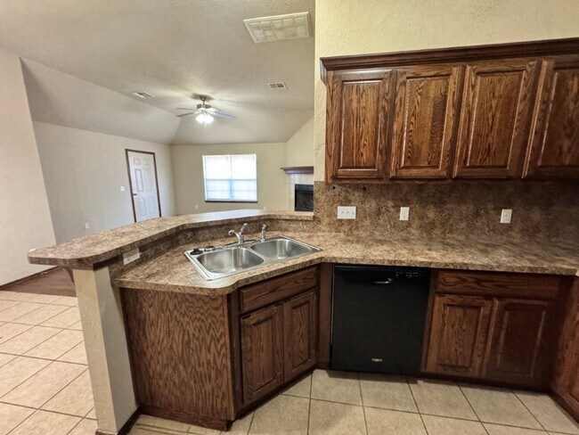 Building Photo - 3-bedroom duplex with new carpet in the bedrooms and a 2-car garage ready for move in!