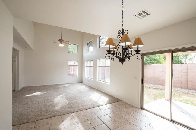 Hall and dinning area. Please note, backyard has been remodeled and photo will be updated - 2591 E Bellerive Dr