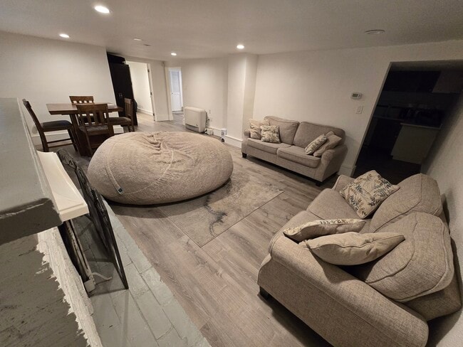 Spacious living and dining room with fireplace - 4733 Sand Point Way NE Townhome