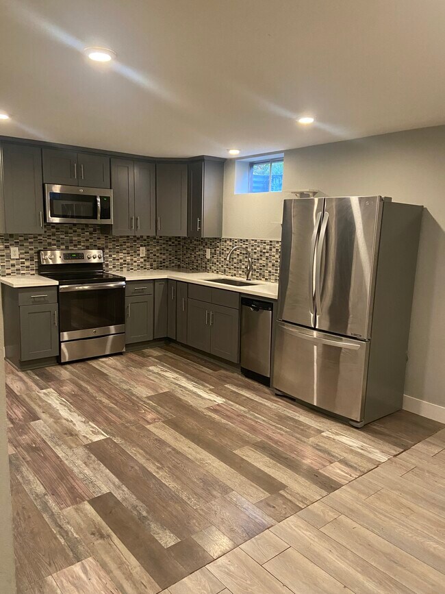Kitchen- stainless steel appliances, electric range, garbage disposal - 3901 N Kiska St