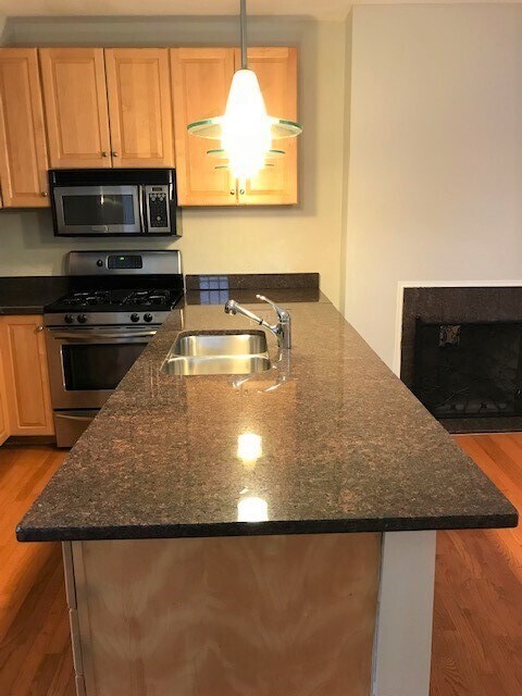 Eat at island with granite counter top with built in sink & dishwasher - 5934 Elwood St