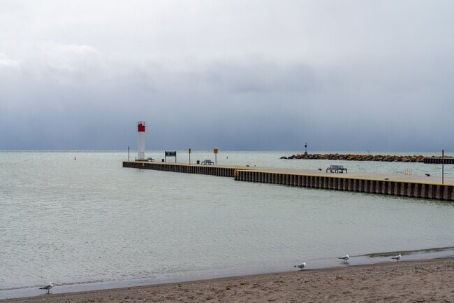 Whitby Harbour lighthouse on a cloudy day.