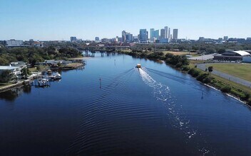 Boats head up and down this river through the middle of the city. - Anchor Riverwalk