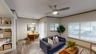 This single-floor residence in Austin, TX offers a thoughtfully designed layout across two bedrooms and one bathroom. The open-plan living and dining area serves as the heart of the home, featuring wood-look flooring, crown molding, and a ceiling fan with integrated lighting. Multiple windows with blinds fill the space with natural light, while a sliding glass door provides additional brightness and outdoor access. The dining nook is defined by a stylish pendant light overhead, creating an inviting atmosphere for meals.

The galley-style kitchen is outfitted with white shaker cabinetry, quartz countertops, a stainless steel sink, and stainless steel appliances, including a refrigerator. A tiled backsplash adds a modern touch, and the kitchen conveniently opens to the in-unit laundry area, which houses a full-size side-by-side washer and dryer.

The primary bedroom is generously sized, offering a calm, neutral palette and a walk-in closet equipped with multi-tier wire shelving for ample storage. The shared bathroom features a wide vanity with quartz countertops, white cabinetry, a large mirror with a multi-bulb light bar, and a full tub-shower combination. A welcoming hallway entry with wood-look flooring completes this efficiently designed Austin home.