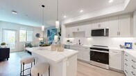 Located at 1151 Encanto Loop in Chula Vista, CA, this thoughtfully designed one-bedroom, one-bathroom residence offers a clean, contemporary aesthetic throughout its efficiently planned single-floor layout. Light wood-style flooring flows seamlessly through the main living areas, creating a bright and cohesive atmosphere.

The kitchen is a standout feature, showcasing white shaker cabinetry, a white quartz waterfall-edge island with bar seating, subway tile backsplash, stainless steel appliances, and elegant pendant lighting — all opening directly to the living area for a connected, open-concept feel.

The living room is airy and well-lit, benefiting from a large window and a sliding glass door that invites natural light and outdoor views of the surrounding greenery. A connecting hallway provides access to the bedroom, bathroom, and closet.

The bedroom is a serene retreat with large windows framing outdoor views, light flooring, and ample space to furnish comfortably. The full bathroom features light gray cabinetry, a white countertop vanity, a framed mirror, and warm wood-tone flooring, delivering a clean and polished finish. A dedicated closet and hallway complete the practical layout, making this residence as functional as it is visually refined.