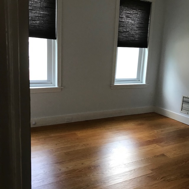 Bedroom 2, modern ceiling fan & original hardwood floor - 682 W Johnson St