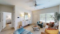 Located at 5171 Bowman Rd in Macon, Georgia, this single-story, 2-bedroom, 2-bathroom home offers a thoughtfully designed layout that maximizes functionality and comfort. The open-concept living and dining area serves as the heart of the home, bathed in natural light through large windows with blinds. The living space features light hardwood-style flooring, a ceiling fan, and access to the front entry. The adjacent dining area is accented by a modern chandelier, creating a welcoming atmosphere for entertaining.

The kitchen is well-equipped with white shaker cabinetry, stainless steel appliances including a refrigerator, range, microwave, and dishwasher, plus ample counter space and a double sink. The two bedrooms are generously sized, with the primary bedroom offering a spacious layout. Two closets provide organized storage throughout. Both bathrooms include tub-shower combinations with clean, bright finishes.

A dedicated laundry room with washer and dryer hookups and built-in shelving adds everyday convenience. The attached garage provides direct interior access along with additional utility and storage space. A separate utility room rounds out the practical offerings of this efficiently designed home.