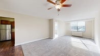 This 530 square foot apartment in Cincinnati offers a blend of compact living and modern amenities. The space is efficiently designed with two bedrooms, including a primary bedroom of 300 square feet, and one bathroom. The kitchen is a standout feature, boasting wooden cabinetry, stainless steel appliances, and granite countertops. Wood-style flooring in the kitchen and main living areas adds warmth, while plush carpeting in the bedrooms ensures comfort.

The bathroom is pristine, with a white tiled shower/tub combination and modern fixtures. Large windows in the bedrooms and living area flood the space with natural light and offer views of the urban landscape. A ceiling fan in the main living area provides additional comfort and air circulation.

Storage is cleverly integrated with sliding closet doors in the bedrooms. The apartment's neutral color palette, dominated by whites and beiges, creates a sense of spaciousness and allows for personal decorating touches. Despite its compact size, the layout maximizes functionality, making it an ideal urban dwelling in the heart of Cincinnati.