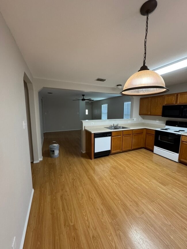 Kitchen view into living room - 8127 Willow Country
