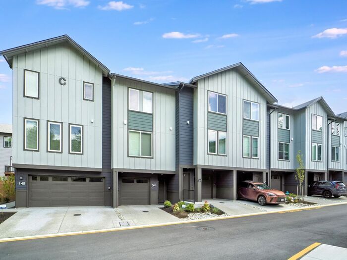 Primary Photo - Charming 3-Bedroom Townhome with Modern Am...