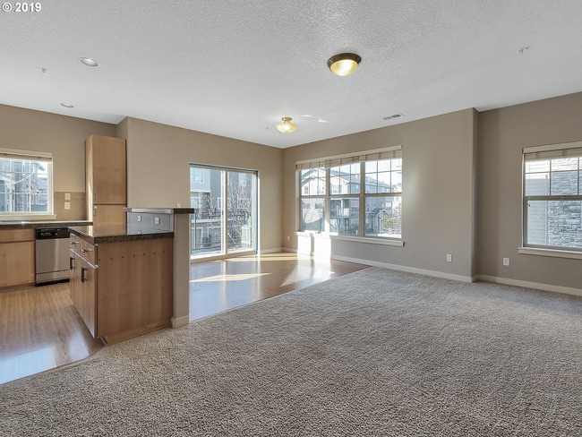 Photo - 2BR + 2.1BA Corner Townhome-Style Condo — Dual Primary Suites, Attached Garage & Most Utilities I...