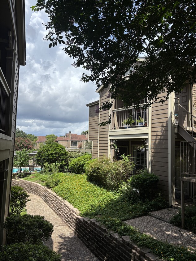 Outdoor view of front of unit adjacent to pool - 1860 White Oak Dr