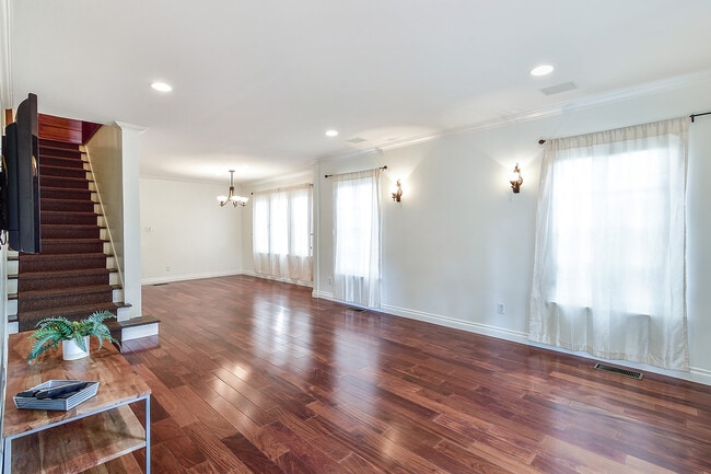 View of living/dining room from entry - 8459 W 4th St Townhome