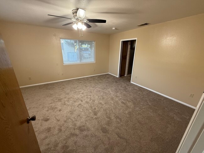 Main bedroom, new flooring throughout - 15936 Lime St