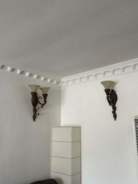 Living room wall sconces with beautiful crown molding. - 1859 1/2 Pandora Ave