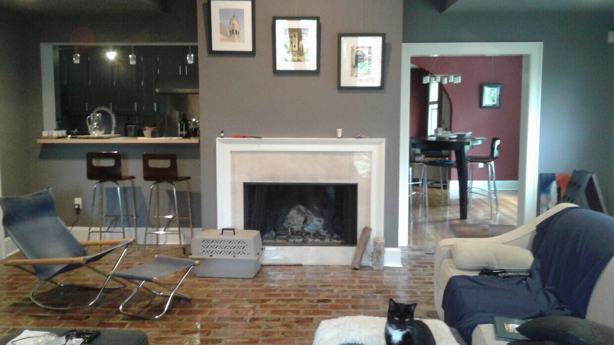 Living Room with fireplace and brick floor - 4182 Hyacinth Avenue