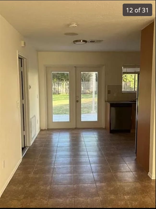 Building Photo - 2/2/1 home with a spacious fenced backyard...