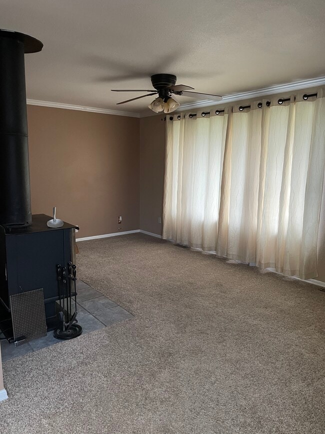 Living room with wood burning stove - 12409 2nd Ave S