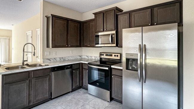 Building Photo - Pet-Friendly Corner Unit with Attached Garage & Smart Home Features