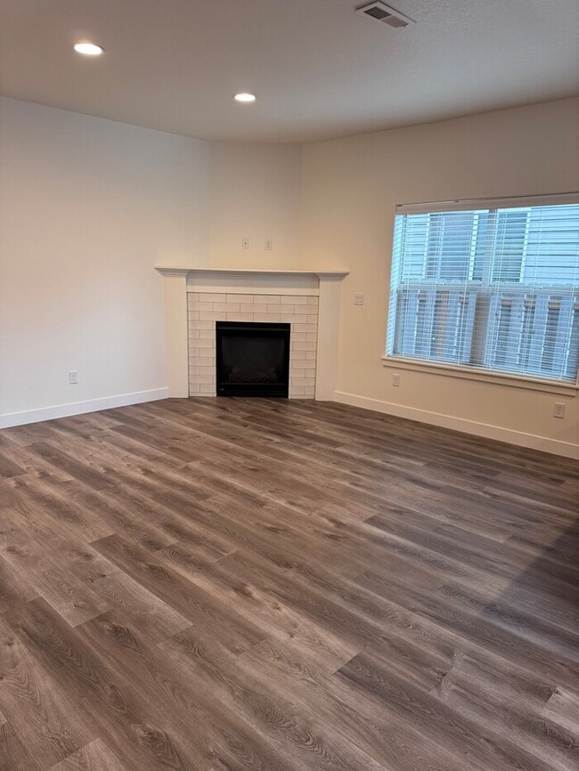 Building Photo - Beautiful Home with LVP Flooring, SS Appliances, Garage, W/D, Fenced Yard, LARGE Master & MORE!