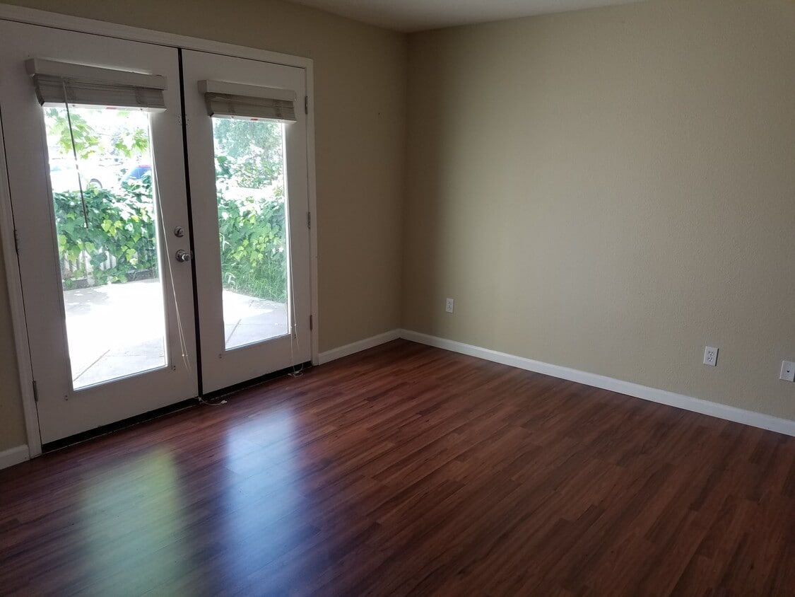The bottom floor room has beautiful french doors that open up to the patio area. Great for barbecues! - 2878 Hilltop Mall Road